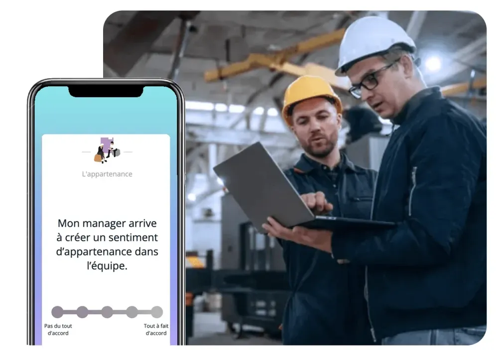 Deux ouvriers en casque devant un ordinateur portable, avec une question de l'enquête affichée sur un smartphone